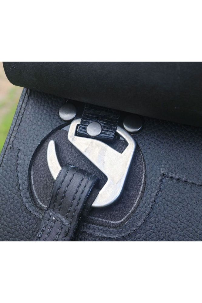 A close up of the Swing stirrup bar on a Classic Jet black TCS saddle