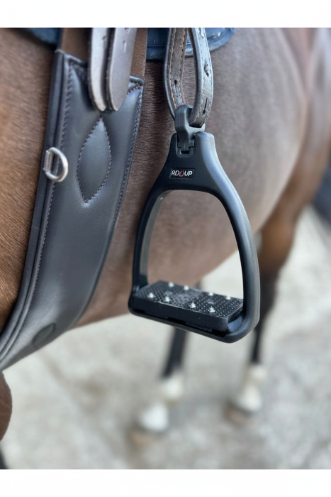 A close up of safety stirrups with a 90 degree eye which reduces bulk under the rider's leg