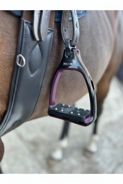 A close up of safety stirrups with a 90 degree eye which reduces bulk under the rider's leg