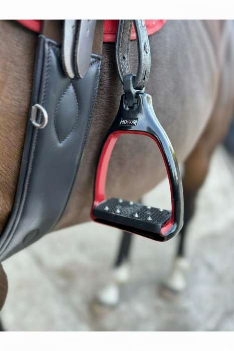 A close up of safety stirrups with a 90 degree eye which reduces bulk under the rider's leg