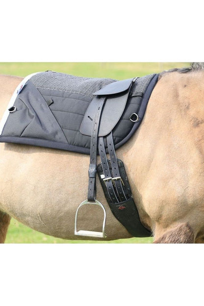 A black Classic Total Contact treeless saddle on a dun horse wearing a black saddle pad